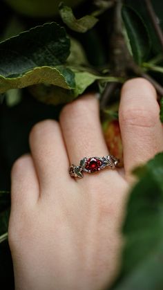 "\"Oak Leaf\" Sterling Silver Ring b Chronicles. Red garnet oak twig ring for her. Nature wedding ring with different stones options: amethyst, garnet, citrine, peridot, cubic zirconia, and others. Silver Oak Twig Pagan Wedding Ring. Material: Sterling silver, 925 silver, recycled material. Stone: Amethyst, Citrine, Cubic zirconia, Garnet, Peridot, Opal, Topaz, Sky Blue Topaz, Swiss Blue Topaz, London Blue Topaz Ring Size: All sizes from US 5 to US 16 are available.   IF YOU NEED ANOTHER SIZE, PLEASE, CONTACT US! Handmade model of the ring! This ring was created entirely in our workshop.  Our master created the design. We don't use 3D modeling, we make our rings by ourselves! 💗 Thank you for visiting our shop! Take a look at other items in the collection of wedding rings! 30% off sale! ht Tree Branch Ring, Nature Wedding Ring, Pagan Wedding, Tree Jewelry, Silver Oak, Twig Ring, Branch Ring, London Blue Topaz Ring, Silver Tree