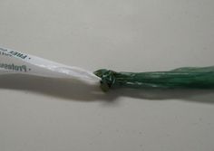 a white and green toothbrush sitting on top of a table