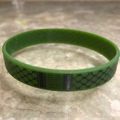 These Kuffiyeh Wristbands are made of rubber and available in 3 colors! Select your favorites from our Black, Green & White bands! White Band, Wristbands, Black Green, Band, Green, White, Black