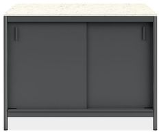 a gray cabinet with two doors and a marble top on the bottom, against a white background