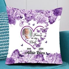 a personalized pillow on a couch with purple flowers and butterflies in the frame that reads, loving mom