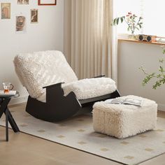 a living room with a white chair and ottoman next to a window in the corner