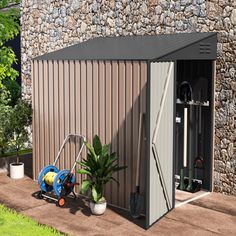 an outdoor storage shed with plants and tools in it