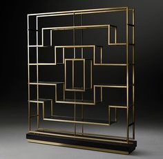 an art deco display case with gold and black geometric designs on the front, side, and back sides