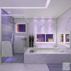 a white bathroom with purple lighting and marble walls