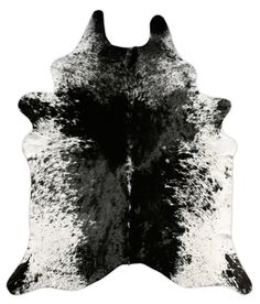 a black and white cowhide rug on a white background