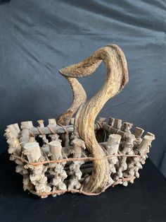 an artistic sculpture made out of wood sticks