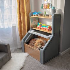 a child's toy storage unit in the corner of a room