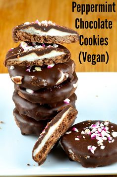 chocolate cookies with white and pink sprinkles stacked on top of each other