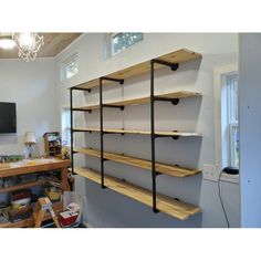 a room with some shelves on the wall