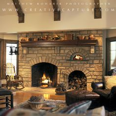 a living room filled with furniture and a fire place