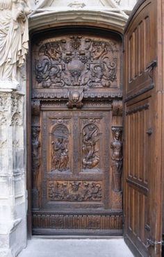 an old wooden door with carvings on it