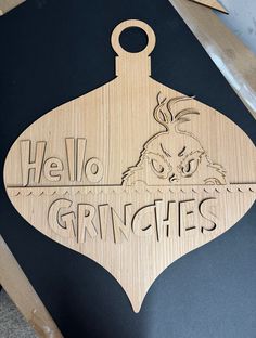 a wooden ornament that says, hello gringies