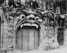 a black and white photo with an angry face on the side of a building that says, tober la maga le cabret l'enfer you are welcome