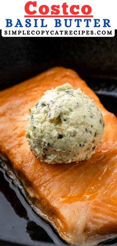 a piece of salmon on top of some sort of butter in a skillet with the words costaco basil butter above it