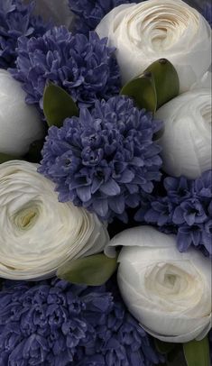 a bouquet of white and blue flowers