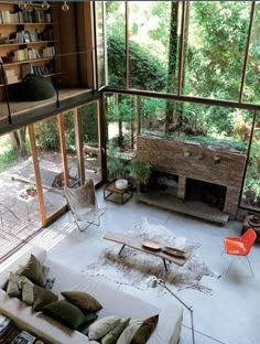 an instagram photo of a living room with lots of windows and furniture in it