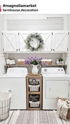 a white washer and dryer sitting next to each other in a laundry room