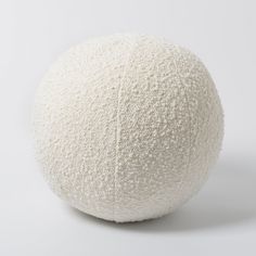 a white ball sitting on top of a table