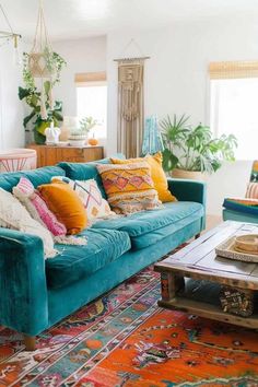 a living room filled with furniture and lots of pillows