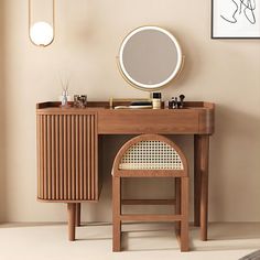 a wooden desk with a mirror and stool