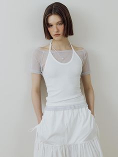 This is a minimal and feminine top by Lucirzu that is made out of high quality and sturdy material. With distinctive mood of the design and comfortable wear, you can use it for your daily lifestyle.- Trendy layered detail- Off shoulder t-shirt and halter sleeveless top set up- Silver logo embellishment detail- Modern and minimal mood Halter Top Layered Outfit, Modern White Crop Top For Spring, Modern White Spring Crop Top, White Fitted Tank Top For Everyday, Versatile White Tops For Everyday Wear, Versatile White Everyday Top, Versatile White Top For Everyday, Modern White Tops For Layering, White Summer Tank Top With Minimal Stretch