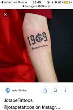 a person with a tattoo on their arm and the number 99 is written in black ink