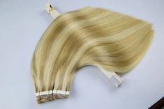 "🍃 100% Virgin REMY HUMAN HAIR , TAPE IN EXTENSION 🌼 MissMizz Beauty Tape in Hair Extensions consist of 20 pieces a pack, a hair extension attached to a tape measuring 4cm in width and 0.8cm in length. 🌵 It made with \"MEDICAL TAPE\" which is safe and has excellent adhesion. 🍃 It is removable with a \"Tape remover\" and can be reused by attaching \"Replacement tape\" 🌼 Available in 4 different 18\",20\" 22\" 24\" lengths and more than 10 real life hair colors. 🌵 Color shows up slightly different based on hair or style. Each color swatch or photo shown can vary from screen to screen as well as production batch as components of the wigs are handmade." Hair Golden Blonde, Golden Blonde Highlights, Hair Tape, Tape In Extensions, Remy Hair Extensions, Bleach Blonde, Golden Blonde, Tape In Hair Extensions, Color Swatch