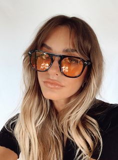 Vintage look sunglasses Aviator style Straight brow bar Black frames Orange tint lenses Moulded nose bridge Slim arms Lens CAT. 0 Length: 14.5cm / 5.70” Height: 5cm / 1.96” Straight Brows, 70s Sunglasses, Orange Sunglasses, Yellow Sunglasses, Sunglasses Outfit, Bar Black, White Bralette, Brow Bar, Black Frames