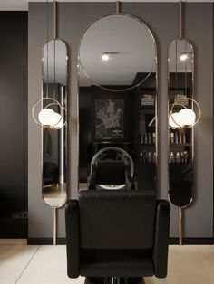 a hair salon with mirrors and lights on the wall, chairs in front of it