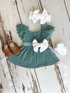 Teal bluish green boho baby girl dress with white velvet flower on sash with matching ankle socks, headband and shoes. OVERVIEW ⭐️ Allow 1-3 days for items to be made and put in the mail, up to 3-5 days for customized outfits ⭐️ See all images within this listing for options ⭐️ Monogrammed outfits are made using a vinyl transfer, not embroidered. ⭐️ These outfits make great baby shower gifts, newborn coming home outfit, 1st birthday and 2nd birthday outfits for your baby boy or baby girl. ⭐️ Mos Easter Outfits Baby Girl, Green Ruffled Dress For First Birthday, Green Fitted Dress For First Birthday, Green Ruffled Dress For Baptism, Green Cotton Dress For Babies, Baby Girl Easter Dress, Baby Girl Easter Outfit, Southern Baby, Easter Outfit For Girls