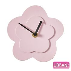 a pink flower clock with black hands on a white background and an urban logo above it