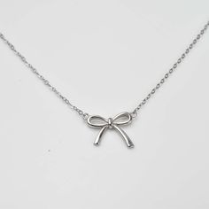 Add a touch of elegance and sparkle to any outfit with our Sweet Diamond Bow Ribbon Necklace. Adorned with delicate diamond and crafted in sterling silver, this bow-shaped necklace is 16 inches long with a 2 inch extender. Perfect for special occasions or everyday wear! Pretty Jewelry Necklaces, Ribbon Jewelry, 16 Inch Necklace, Diamond Bows, Gold Vermeil Jewelry, Ribbon Necklace, Bow Ribbon, Bow Necklace, Bow Jewelry