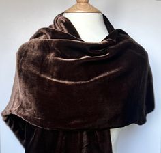 Luxurious and incredibly soft chocolate brown 100% mulberry silk velvet scarf. This scarf is extremely versatile; ideal for wrapping up in the cold weather and offers a touch of glamour to any outfit, whether it be casual or for a special occasion.  This will be perfect as a gift or a treat for yourself.  Composition: 100% mulberry Silk velvet Chic Brown Silk Scarf, Traditional Brown Silk Scarf, Elegant Brown Silk Scarf One Size, Elegant Rectangular Brown Silk Scarf, Luxury Brown Silk Scarf, Velvet Scarf, Brown Silk, Silk Velvet, Mulberry Silk