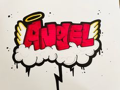 the word angel painted on top of a piece of paper with an angel above it