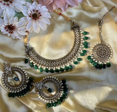 This choker comes in two styles with green or white colors as beads. It is extremely versatile and simple enough to wear for any occasion but can be worn for any evening glam as well! Perfect for the subtle but statement look! Green Desi Jewelry, Green Kundan Necklace For Eid Wedding, Silver Chandbali Kundan Necklace For Marriage, Green Bridal Necklace With Tilla Detail, Green Round Bridal Necklace With Tilla, Green Tilla Bridal Necklace, Round Green Bridal Necklace With Tilla, Silver Chandbali Bridal Necklace, Silver Kundan Necklace For Wedding Bollywood Style