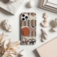 the phone case is designed to look like it has an image of a desert scene on it