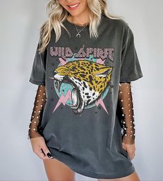 Wear this Comfort Colors Wild Spirit Rock And Roll Vintage Shirt to your next concert or night out. This vintage band tee is slightly distressed and oversized, providing you with trendy style and comfort for that y2k aesthetic. * Ultra soft * Distressed design * Pre-shrunk * Universal fit * True to size * DTG Printing * Brand - Comfort Colors Refunds/Exchanges: * No Cancellations * No returns/exchanges * All sales are final Sizing: Our graphic tees and sweatshirts are a true to size standard uni Vintage Rock Shirt, Graphic Tshirt Outfit, Cute Concert Outfits, Country Concert Shirts, Concert Attire, Metal Shirts, Country Music Shirts, Leopard Shirt, Vintage Band Tees