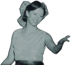 a black and white photo of a woman with her hands in the air, smiling