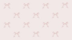 a pink bow pattern on a light pink wallpaper with white bows in the middle