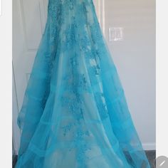 Luxurious Charming Tulle V Neckline Evening Dress With Rine Stones ,And Lace Applique Nwt Never Worn . Size 10 ..Waist 29.75. Hips 39.75. Shoulders Width 15.. 75..Hollow To Floor 59.75 Fitted Blue Organza Evening Dress, Blue Organza Gown For Gala, Blue Organza Gown For Galas, Light Blue Organza Dress For Formal Occasions, Blue Tulle Skirt Evening Dress For Gala, Blue Sleeveless Organza Gown, Sleeveless Blue Organza Gown, Blue Organza Gala Dress, Blue Organza Dress For Gala