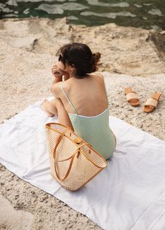 A beach bag to plan a vacation for. Lou is the ultimate summer tote. Made in our signature cane rattan with leather details that elevate it to a handbag. The structured base keeps Lou upright on the sand, so your belongings stay sand-free (as long as no one's tossing pétanque nearby!) and the wider opening gives you extra room for your beach essentials. Pairs perfectly with ocean salty hair and tan lines. Beach Bag Photography, Bag Product Shoot, Product Photography Bags, Beach Branding, Summer Bags Beach, Destination Travel, Hannah Rose, Photography Bags