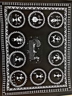 a black and white quilt with different designs on it