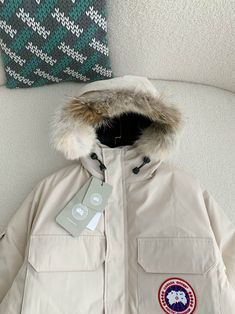 Brave the elements in style with this Canada Goose Expedition Parka-inspired jacket in a sophisticated light neutral hue. This classic design, renowned for its exceptional warmth and durability, features a durable outer shell, a cozy fur-trimmed hood, and many pockets to keep your essentials secure. The signature Canada Goose patch on the shoulder adds a touch of authentic style, making this parka perfect for urban exploration or outdoor adventures. Order your normal size, and we'll reach out to Canada Goose Expedition Parka, Canada Goose Jacket, Goose Design, Fall Winter Jacket, Loafer Sneakers, Urban Exploration, Bottega Veneta Shoulder Bag, Outdoor Adventures, Canada Goose