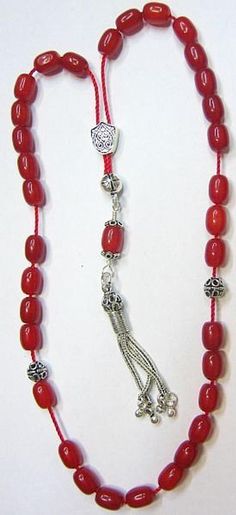 "Special from Swancollection : a magnificient Greek Komboloi - Worry beads Description : 1) Material : RED RUBILITE OF PRIME QUALITY 2) Tassel : Sterling Silver 3) General : 33 Oval beads Length 9 mm & Dia. 2mm 4) Sterling silver separators, Sterling shield and bead caps are in Sterling tassel Pictures describe best FREE SHIPPING WORLDWIDE This is a magnificient item that you will greatly enjoy or that would make a fantatstic gift on any occasion. My selling principle is : \" SATISFACTION OR Spiritual Red Beads, Gems, And Cabochons For Gifts, Red Spiritual Beads And Cabochons For Jewelry Making, Red Gemstone Beads For Gifts, Red Gemstone Beads As Gift, Adjustable Red Rosary With 8mm Beads, Red Spiritual Polished Beads And Cabochons, Spiritual Red Polished Beads And Cabochons, Red Polished Beads For Spiritual Jewelry, Artisan Red Gemstone Beads