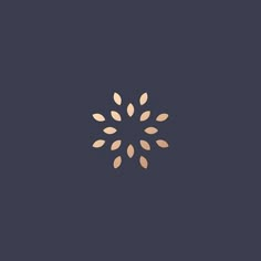 a gold flower on a dark blue background