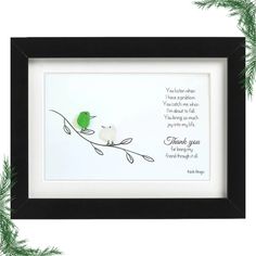 a green and white bird sitting on top of a branch with a poem written in it