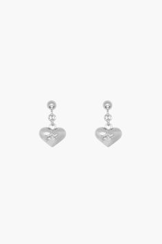 Special little heartsLike your first pair of earringsNever take them off 11mm drop Sterling Silver is a metal alloy containing no less than 92.5% silver Use a dry polishing cloth to clean your jewelry. Tarnishing of jewelry is natural and varies depending on body chemistry, humidity, frequency of use, and care.To minimize tarnishing:- Keep jewelry dry and store in its original pouch - Avoid contact with liquids, perfumes, or any harsh chemicals - Remove jewelry before exercising, swimming, or showering Size Guide + Shipping Info Monthly payments available at checkout with Affirm. Minimalism Jewelry, Body Chemistry, Hair Socks, Sandy Liang, Boot Jewelry, Minimal Jewelry, Keep Jewelry, Dainty Earrings, Ring Box