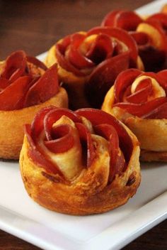 small appetizers are arranged on a white plate