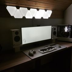 a computer monitor sitting on top of a desk next to a keyboard and mouse pad